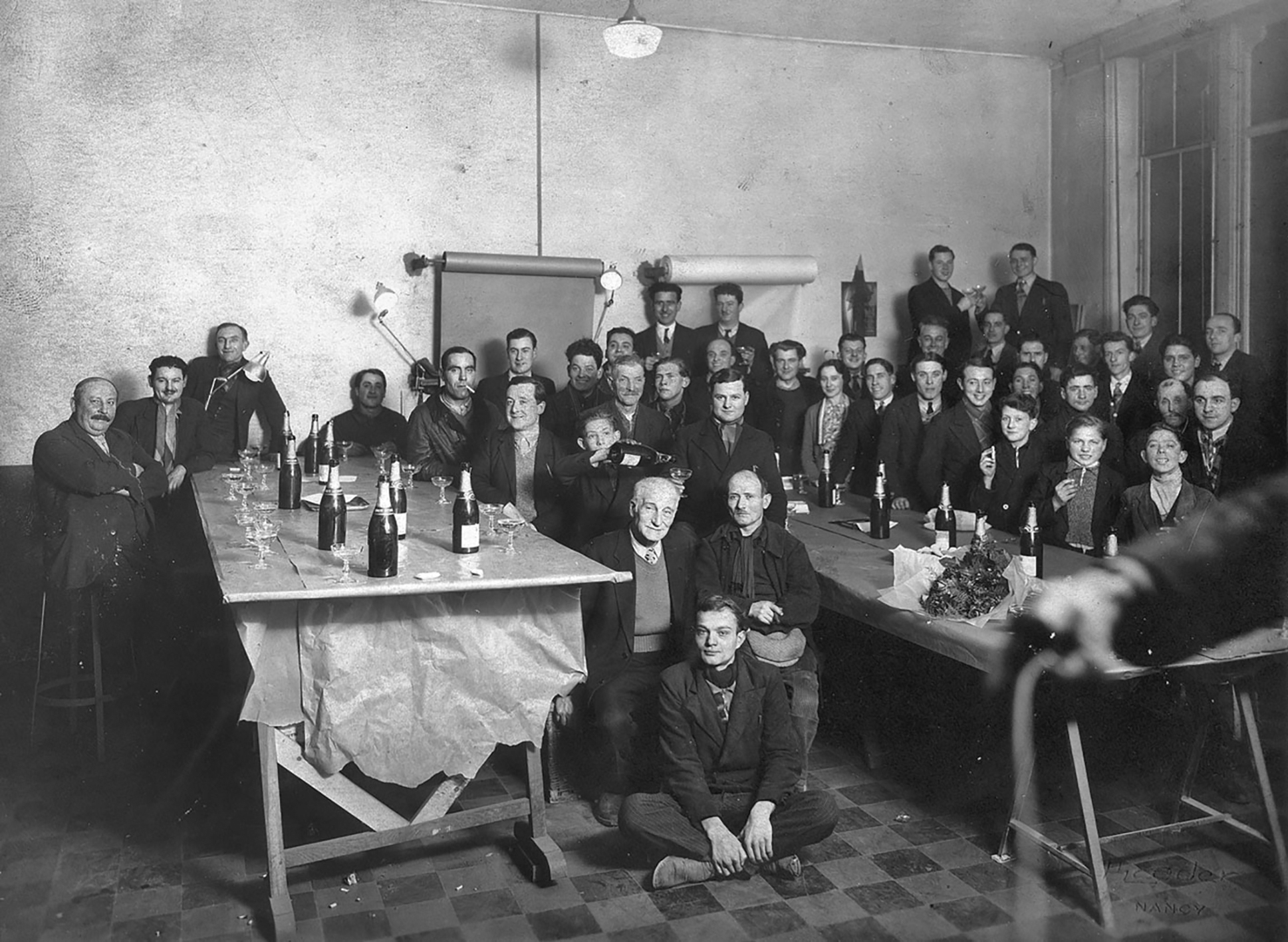 Celebrating the feast of St Eligius, patron saint of metalworkers and blacksmiths, in the design office, c. 1932.