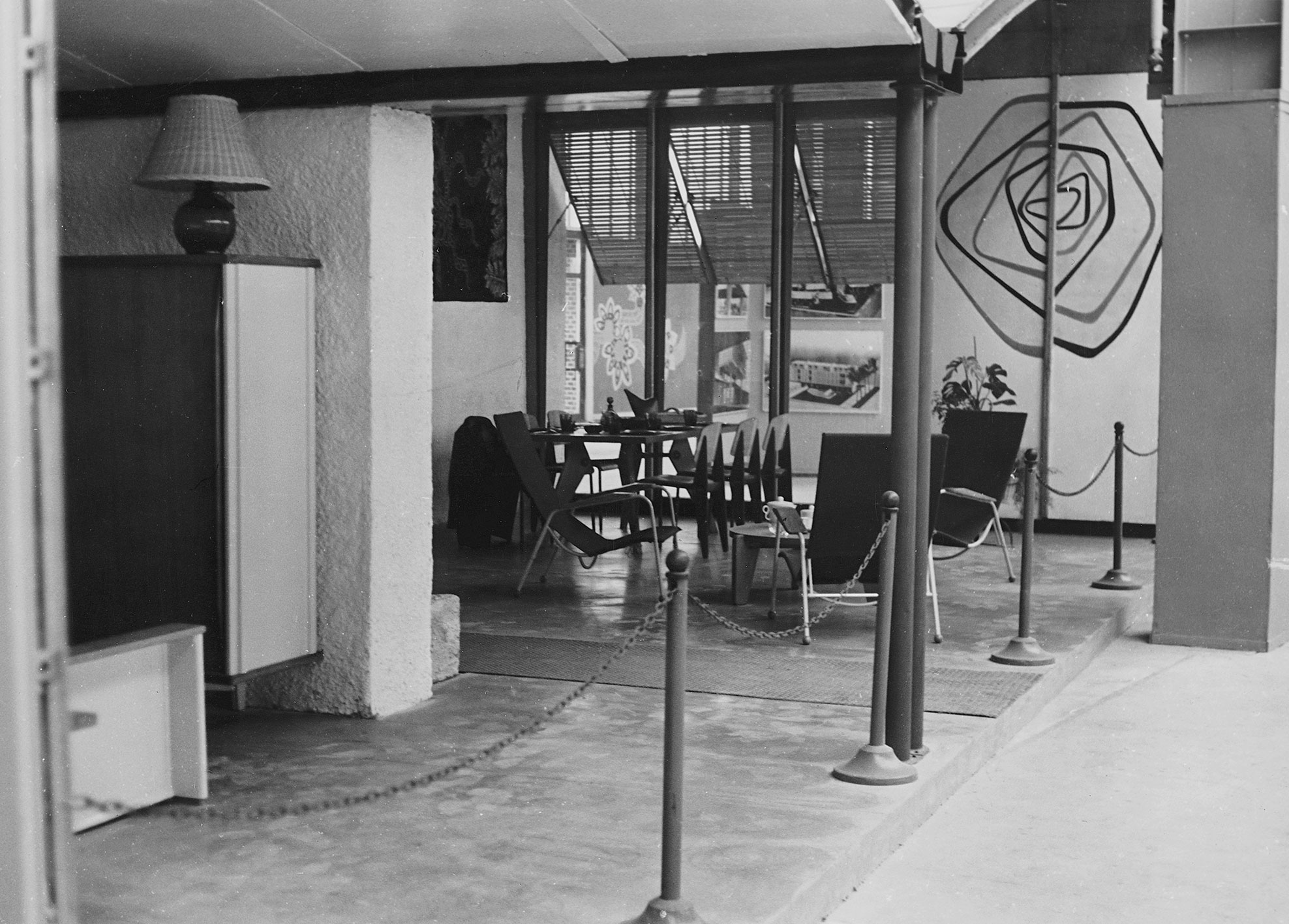 9th Milan Triennial, French section (architect H. Prouvé, 1951). Visiteur Tropique no. 351 armchairs.