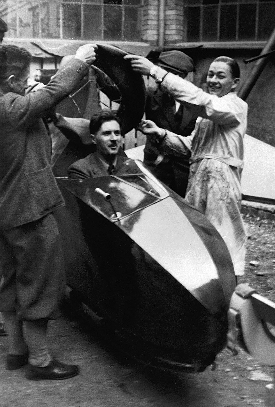 Jean Prouvé testing the cockpit of a glider built by an apprentice in the Rue des Jardiniers workshop, ca. 1936.