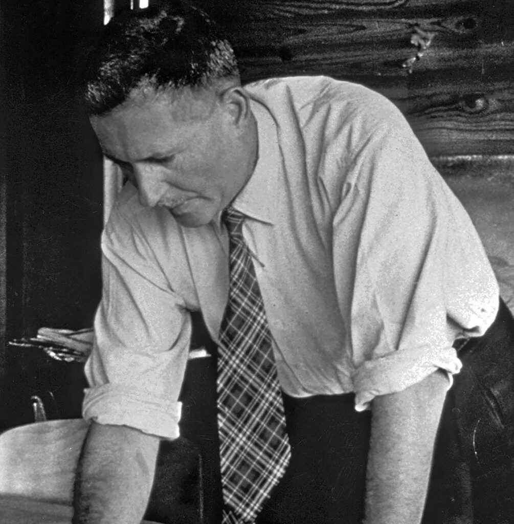 Jean Prouvé dans son bureau des Ateliers, Maxéville, c. 1955.