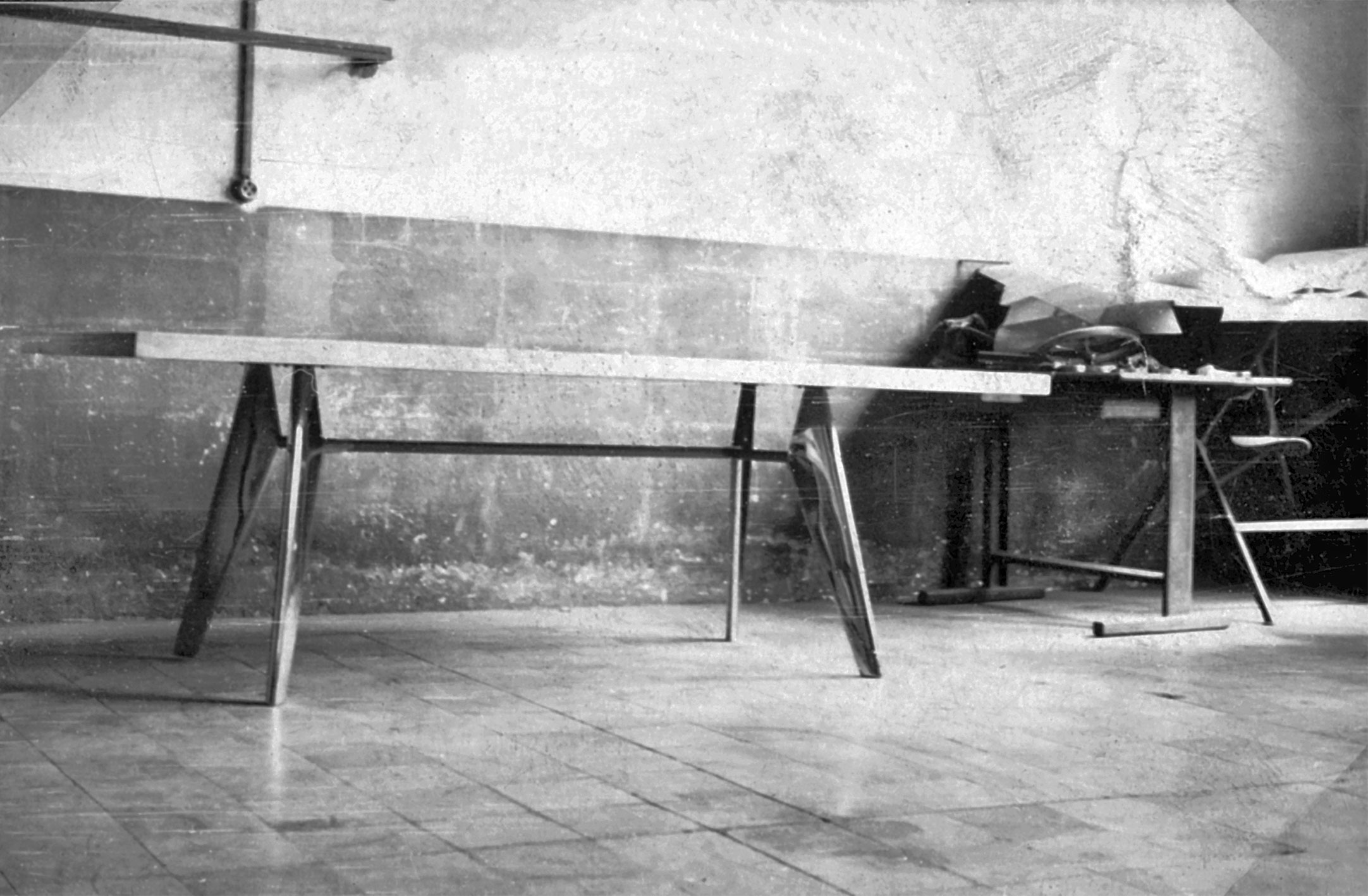 S.A.M. table with non-demountable metal legs. Prototype in the workshop, ca. 1951.