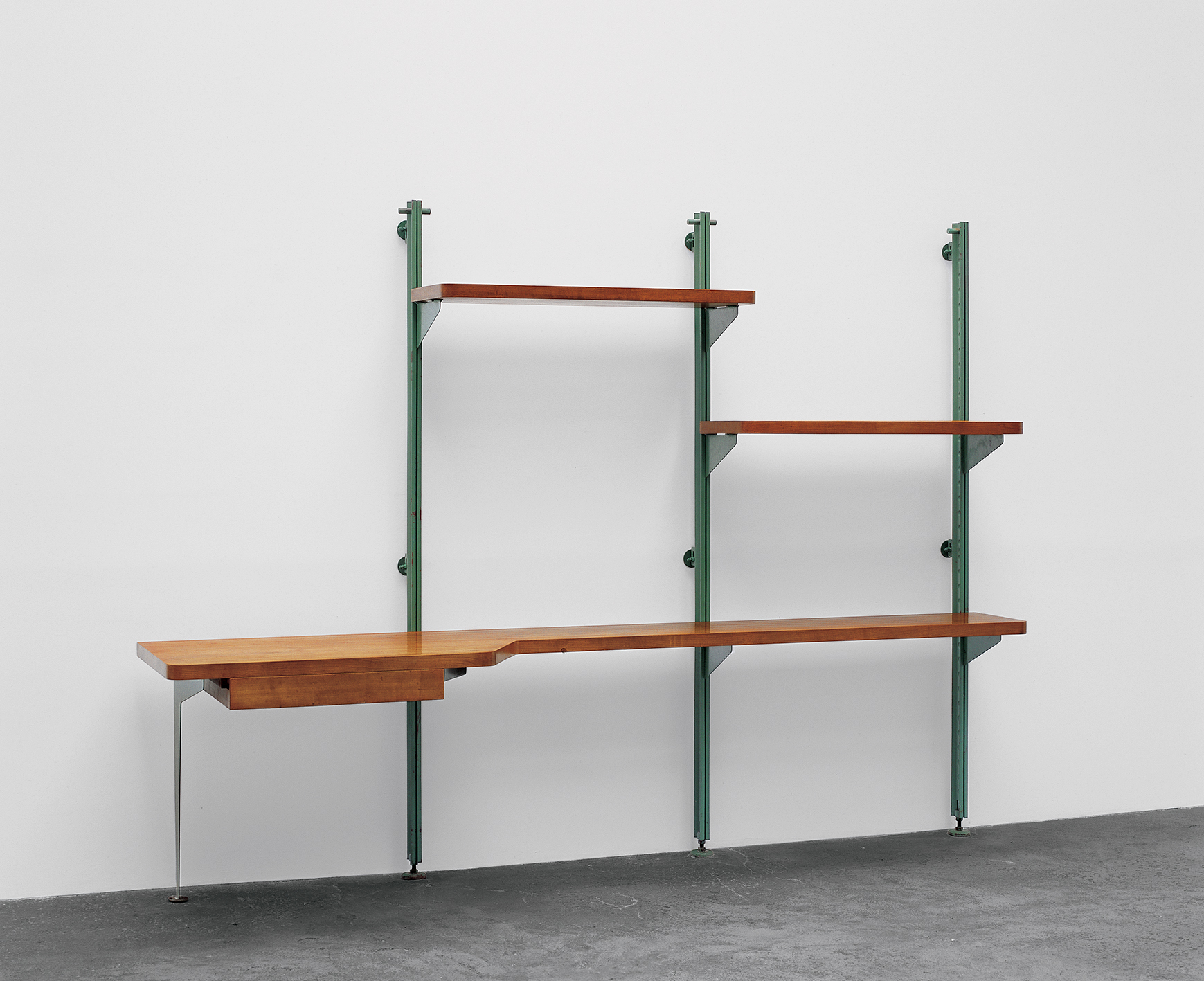 Shelves with support-channels and brackets, on pistons. Special model with 2 shelves and a writing surface/desk, 1951. Provenance: Dollander Villa, Saint-Clair, Var.