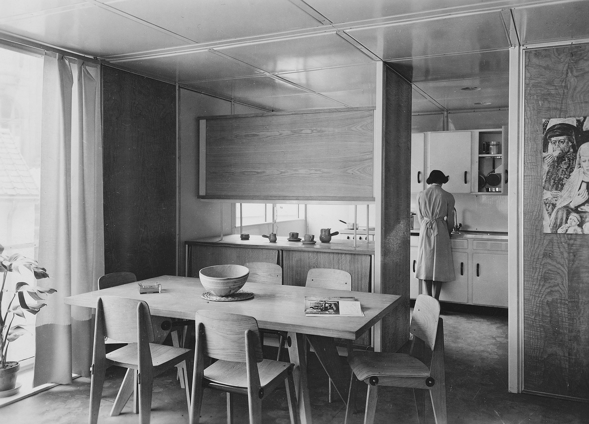 Métropole demountable house Interior views, with Ateliers Jean Prouvé furnishings, of the 8x8 prototype at the Housing Exhibition, Salon des Arts Ménagers, Grand Palais, Paris, February 1950.