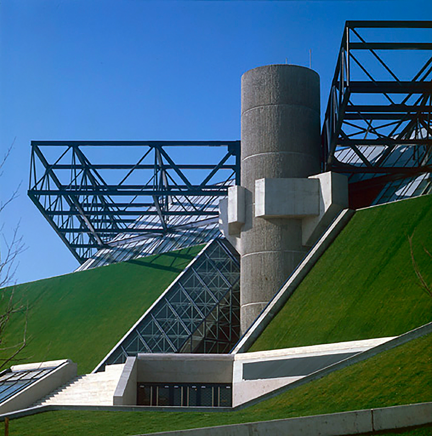 Designs the structure for the Bercy velodrome, Paris, 1976 (M. Andrault and P. Parat, architect).